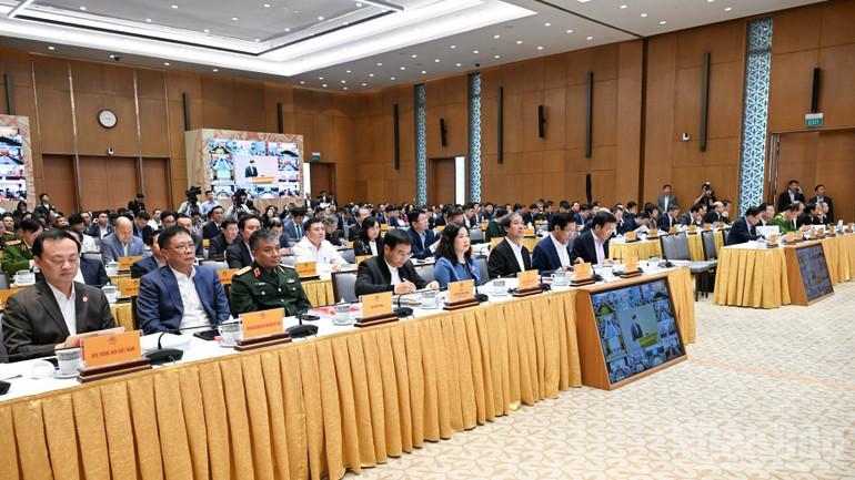 Các đồng chí lãnh đạo, đại biểu tham dự hội nghị. (Ảnh: Trần Hải) ndo_br_b4-3821.jpg